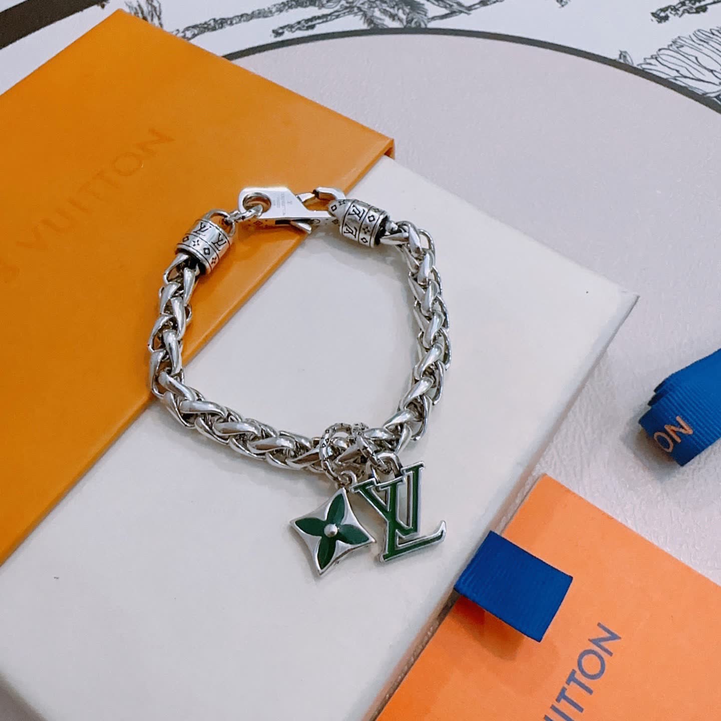Louis Vuitton Silver Bracelet with LV Logo and Green Flower Charm